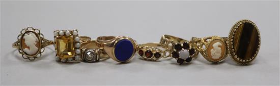 Eight assorted 9ct god and gem set dress rings, including cameo.